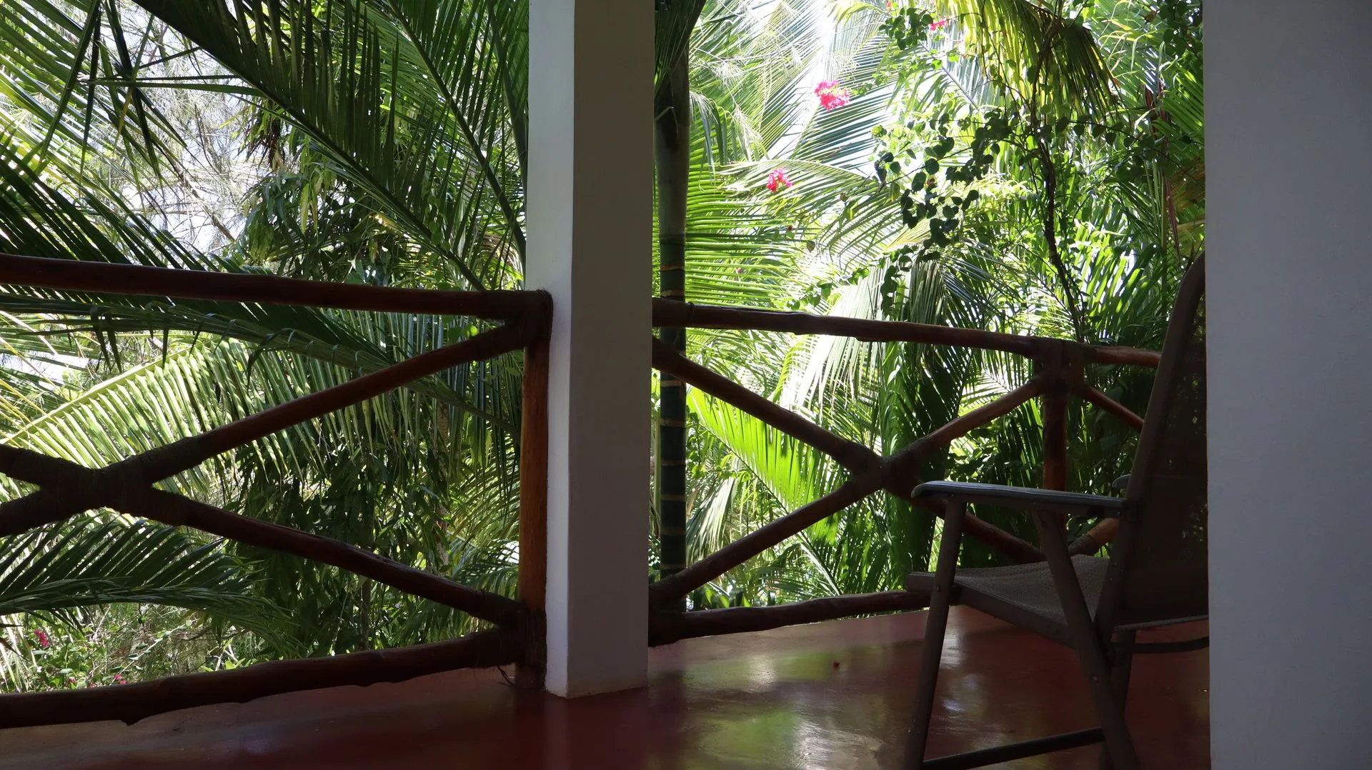 Upstairs balcony overlooking tropical garden at Hamia Zanzibar