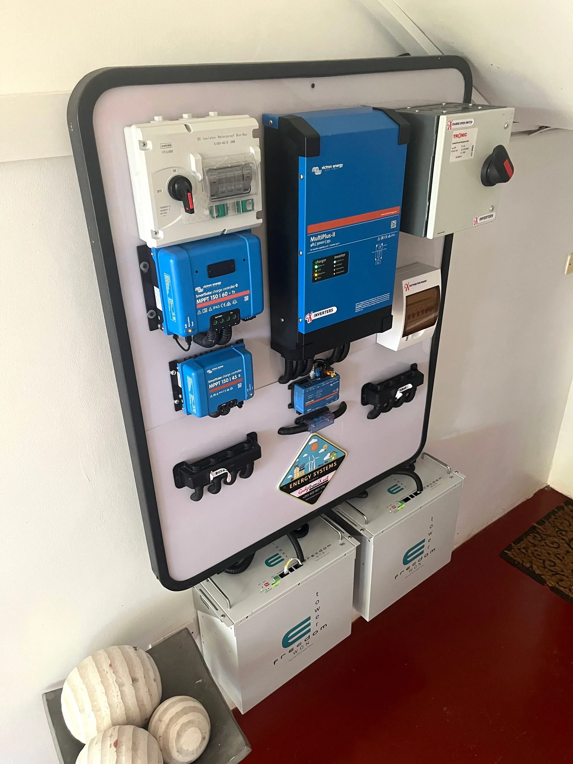 Victron Energy solar power system with MPPT charge controllers, MultiPlus-II inverter, and battery bank at Hamia Zanzibar